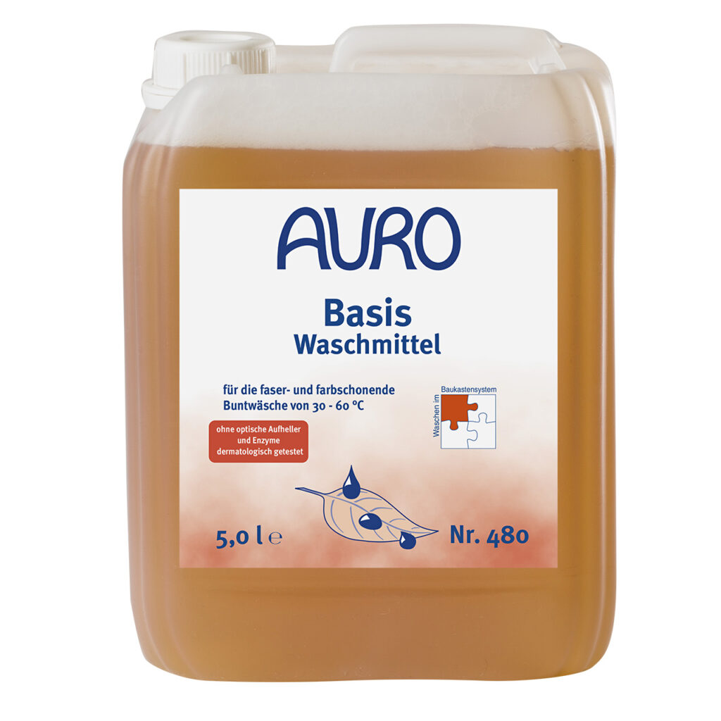 AURO Pflanzenchemie Basis-Waschmittel (5 l) bietet kraftvolle, pflanzliche Reinigung und schonende Pflege. Mit weißem Etikett mit blauem Text, orangefarbenen Akzenten, deutschen Details und einer Puzzleteil-Grafik.